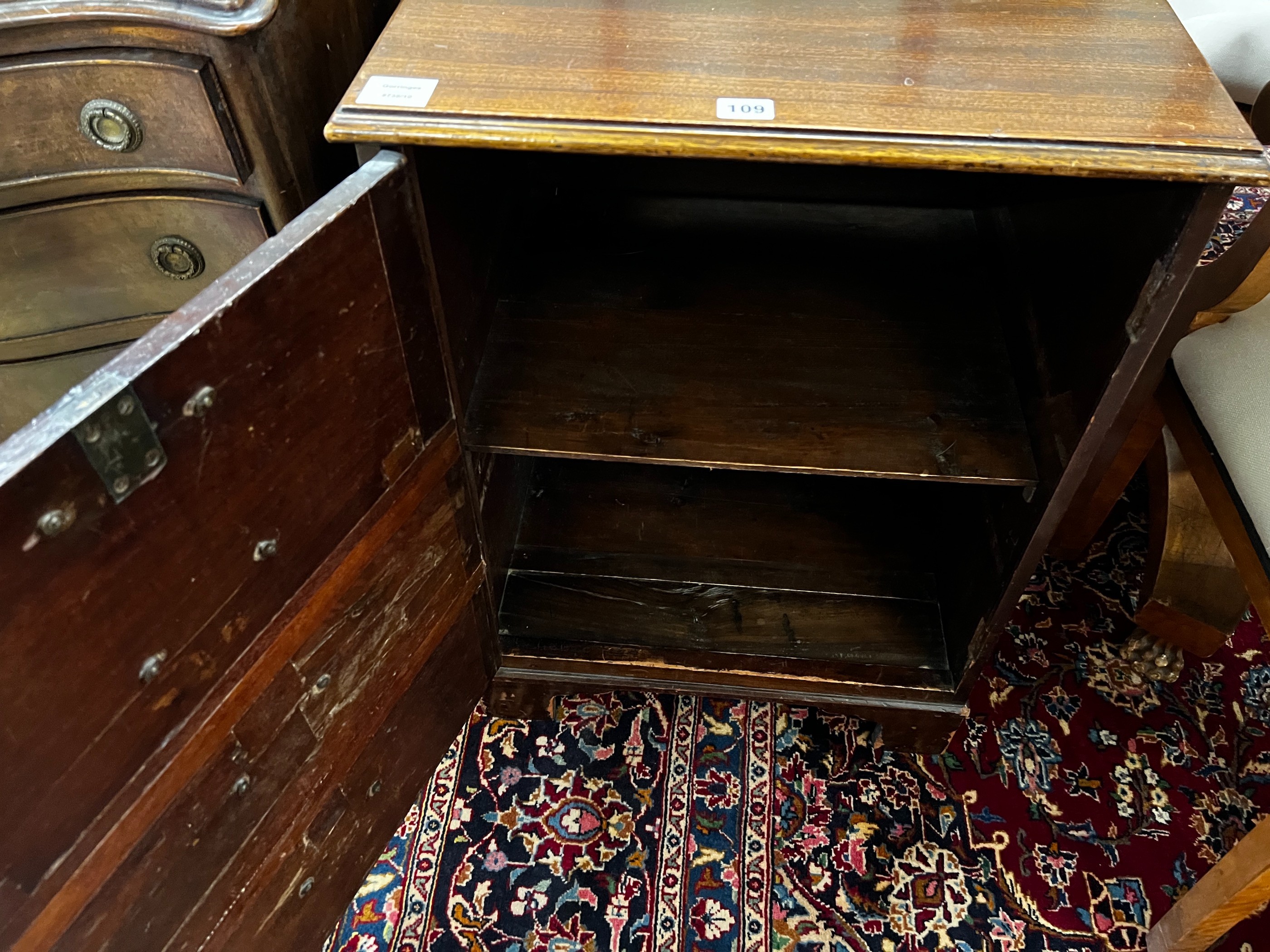 A George III and later mahogany side cabinet with dummy drawer front, incorporates old timber, width 53cm, depth 43cm, height 72cm, and a George III mahogany toilet mirror